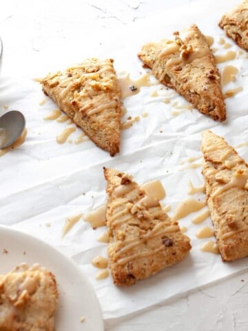 Golden brown scones with maple and walnut flavoring and a maple glaze
