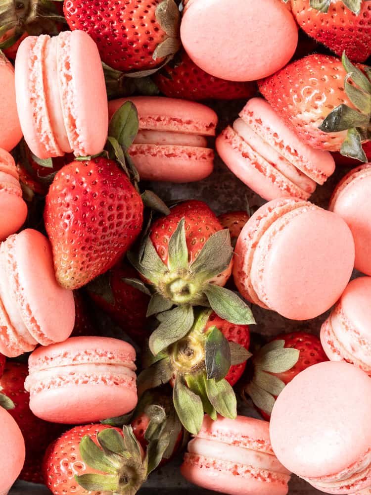 Fresh strawberries mixed in with strawberry macarons