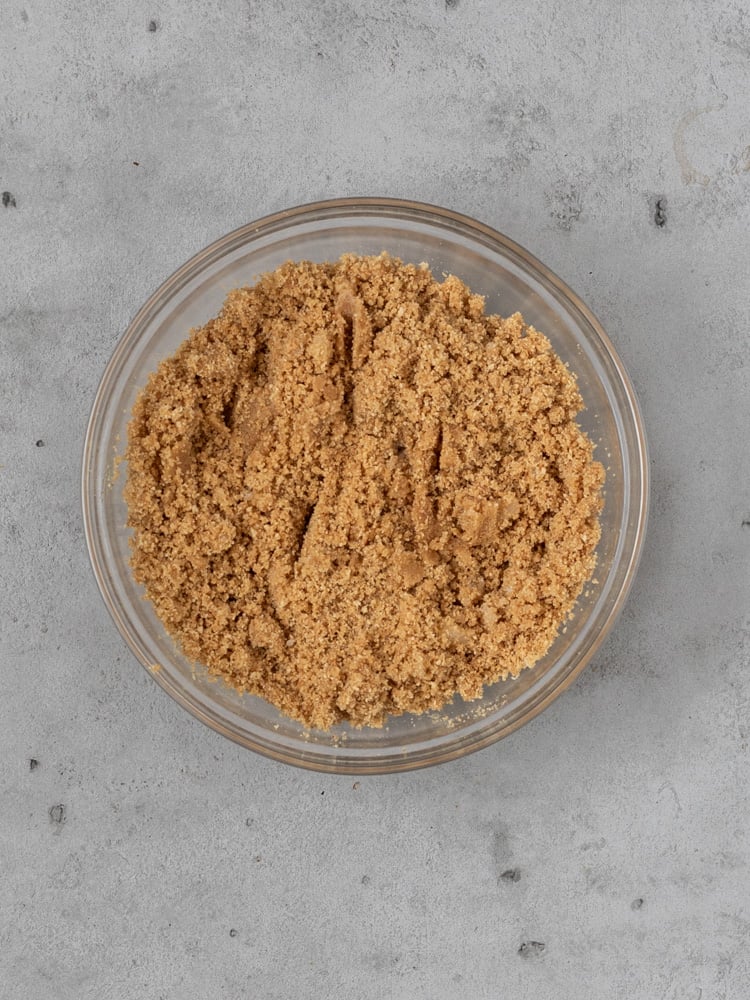 The homemade graham cracker crust ingredients in a bowl