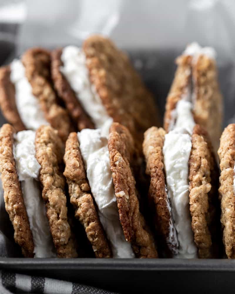 A side view of oatmeal cream pies in a pan