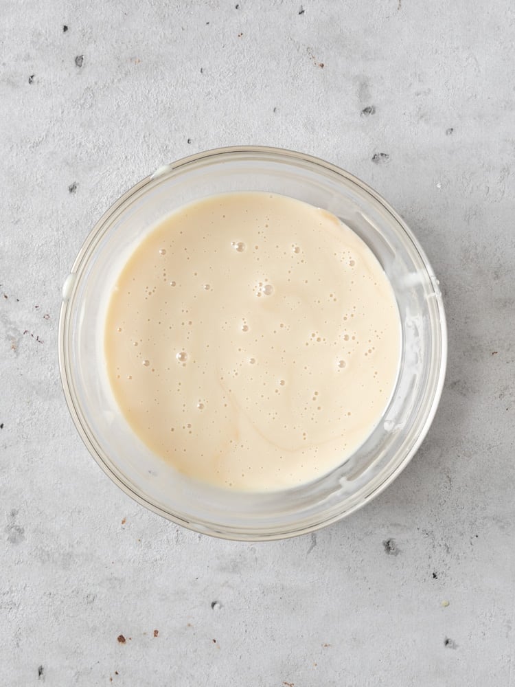 The sweetened condensed milk, vanilla, and salt combined in a bowl