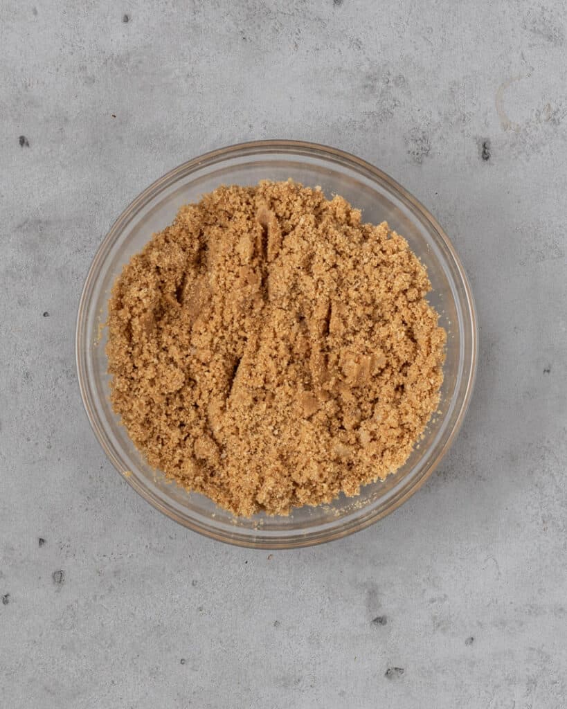 The ingredients for a homemade graham cracker crust in a bowl