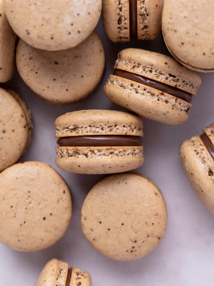 Looking down on a stack of coffee macarons with nutella filling