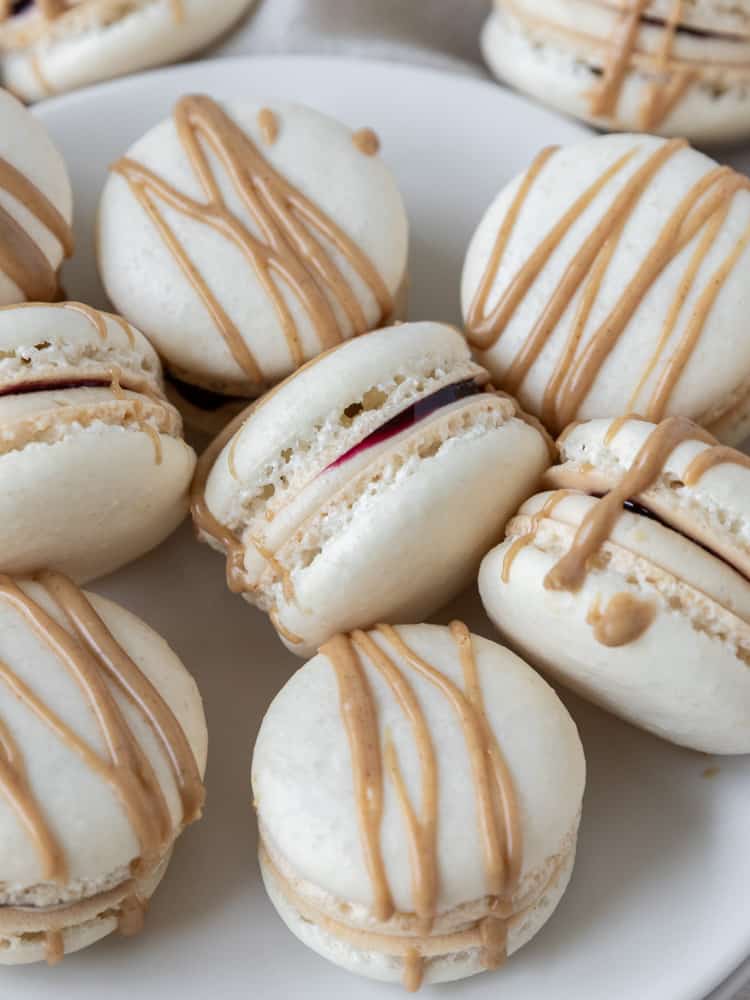 A plate full of peanut butter and jelly macarons