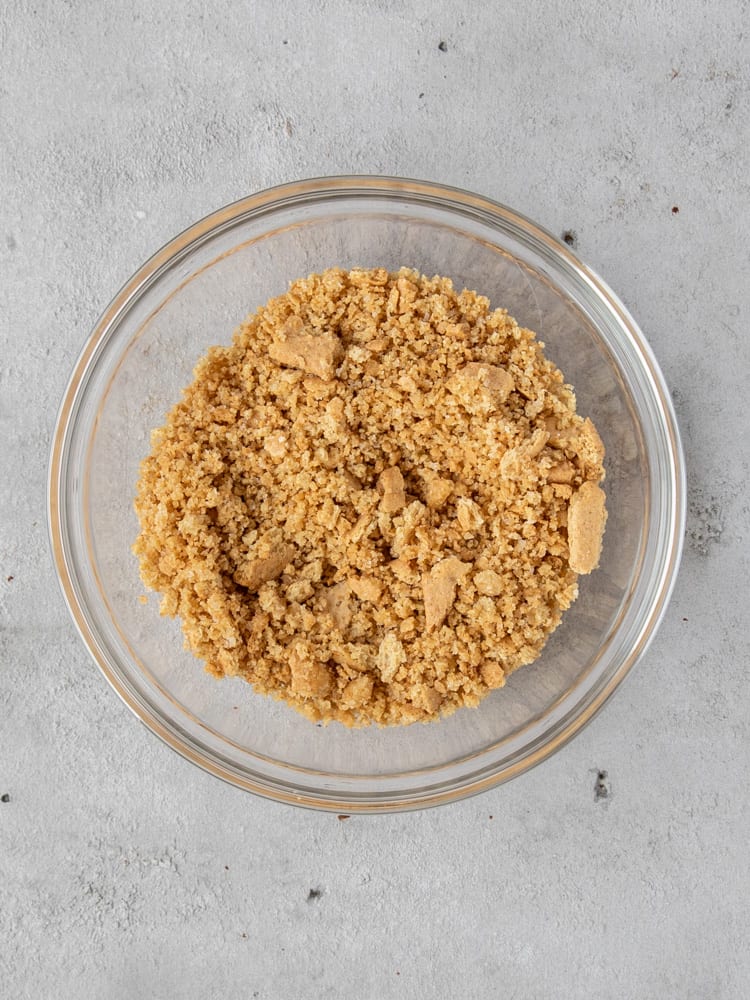 The graham cracker crumbles in a bowl