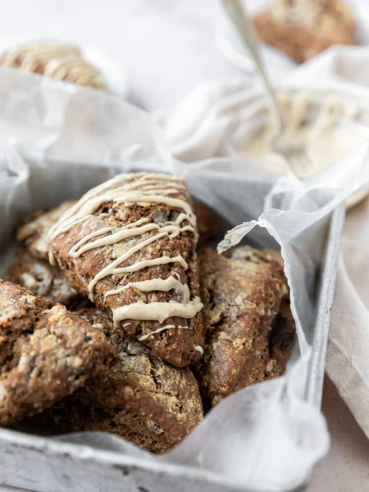 Coffee Scones drizzled with coffee glaze stacked in a pan