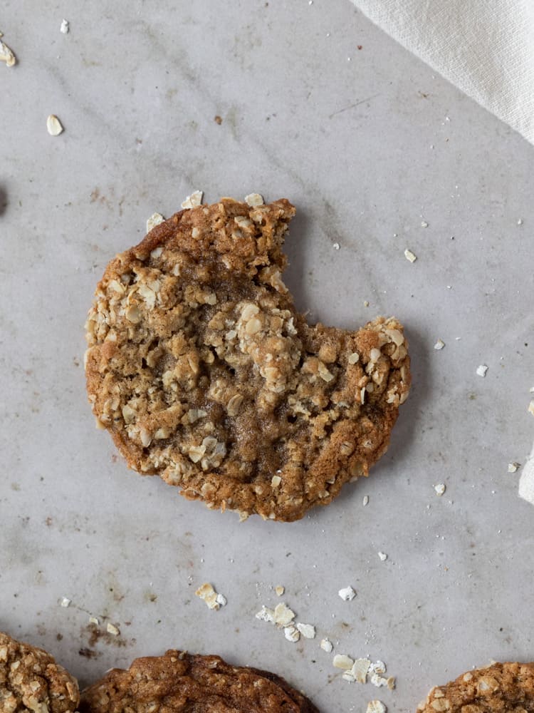 Looking down on a dairy-free oatmeal cookie with a bite out of it