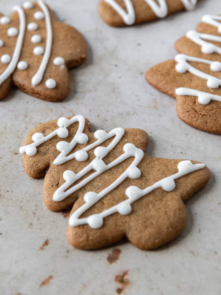 A close up of a soft gingerbread cookie decorated with icing. 