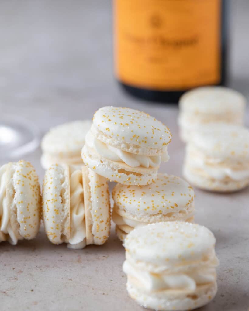 a stack of champagne macarons