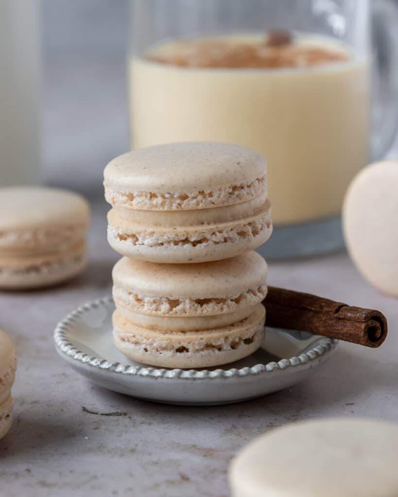 two macarons stacked on a small plate