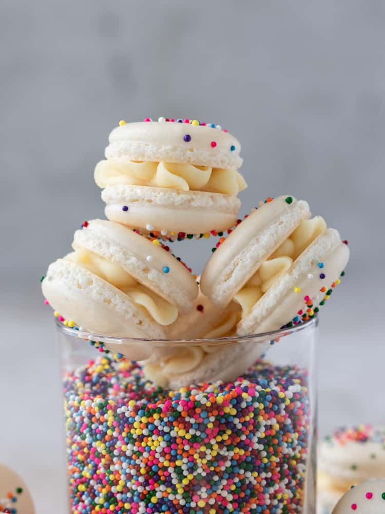 A close up of a stack of birthday cake macarons