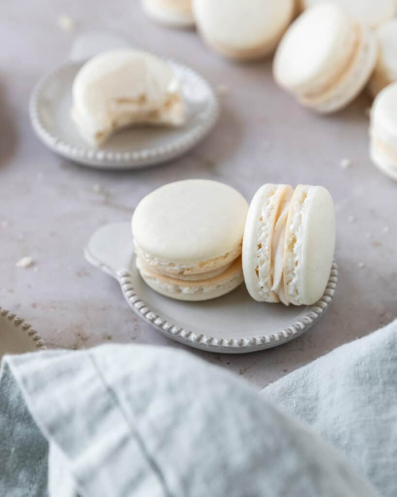 two macarons on a small plate