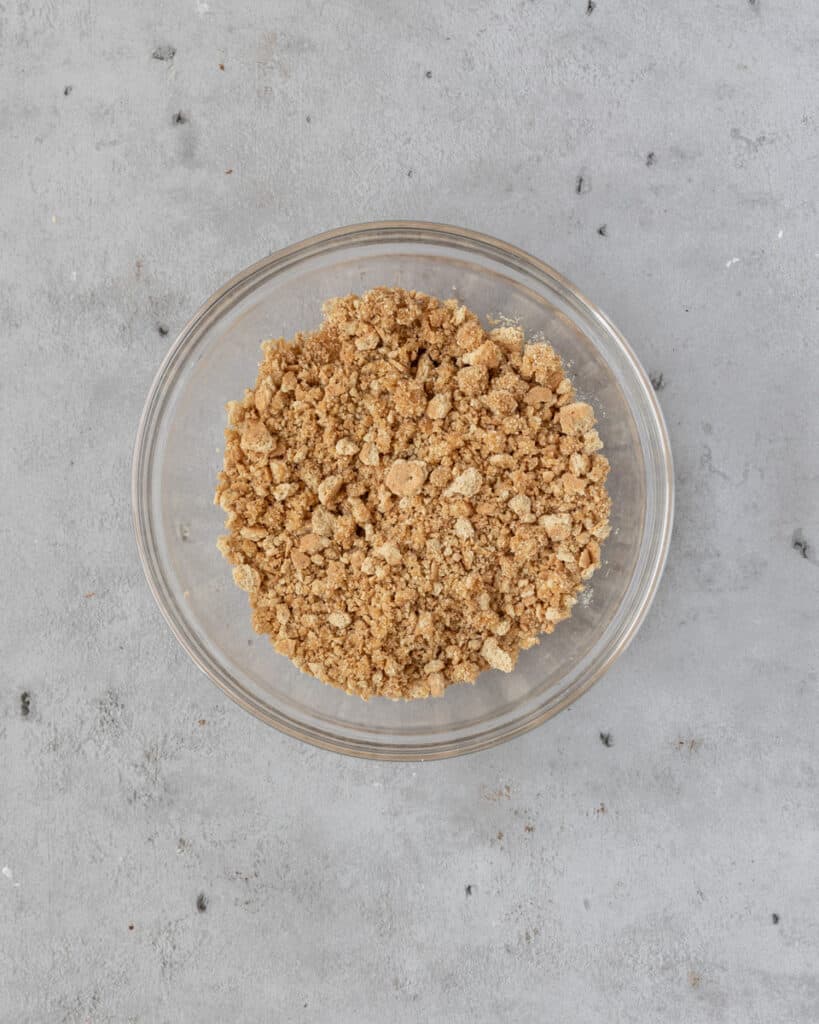the graham cracker crust combined in a bowl.