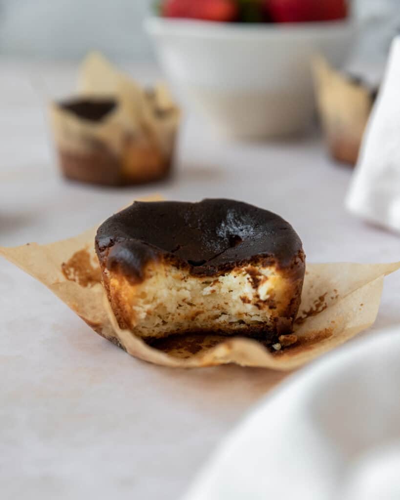 a burnt cheesecake with a bite out of it