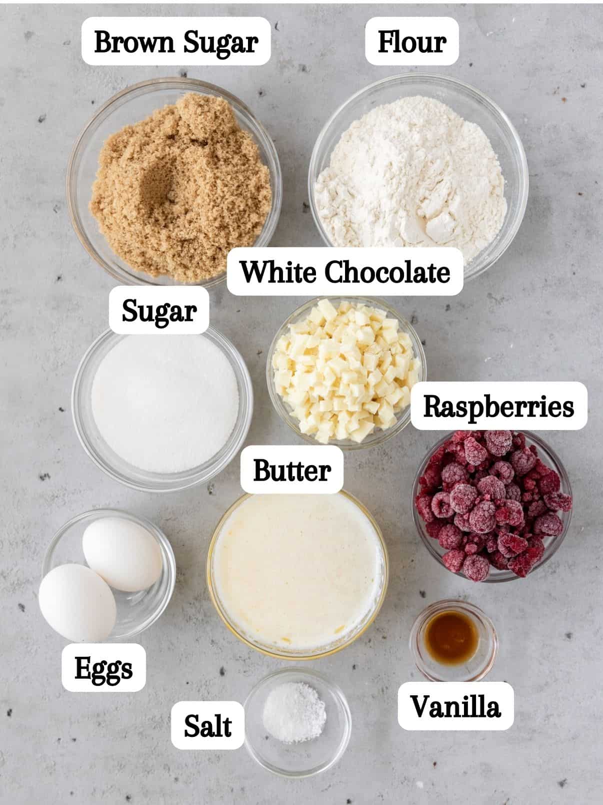 all of the ingredients laid out and labeled on a grey background