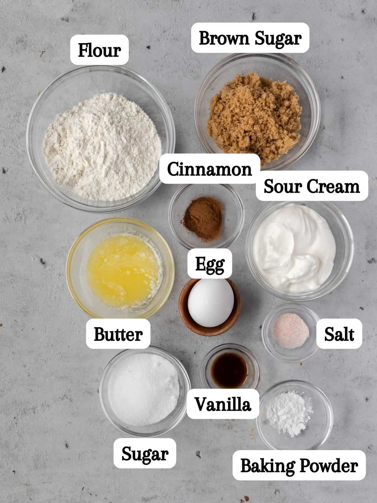 all of the ingredients laid out in glass bowl and labeled on a grey background