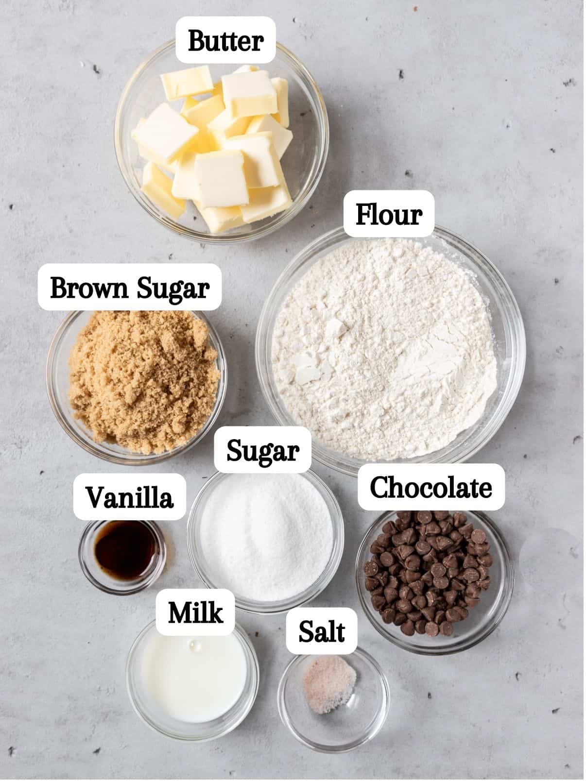 all of the ingredients laid out and labeled on a grey background.
