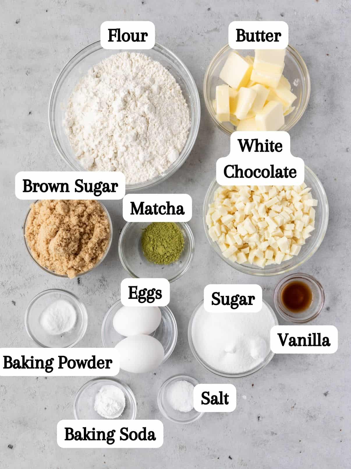 all of the ingredients laid out and labeled on a grey background.