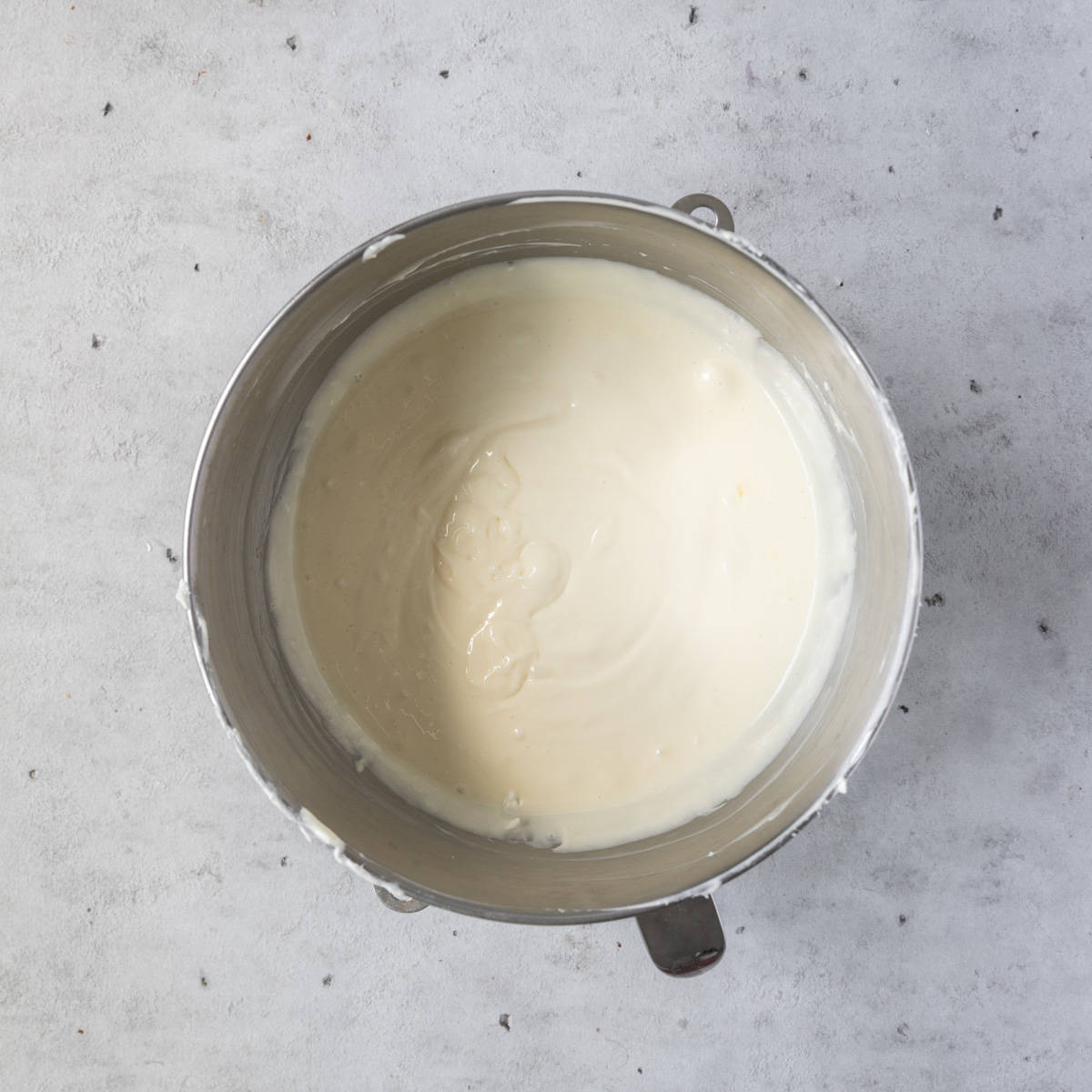 the cream cheese, sugar, cream, salt, and vanilla combined in a metal mixing bowl.