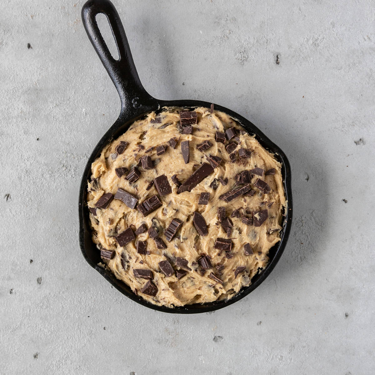 the cookie in a skillet before being baked.