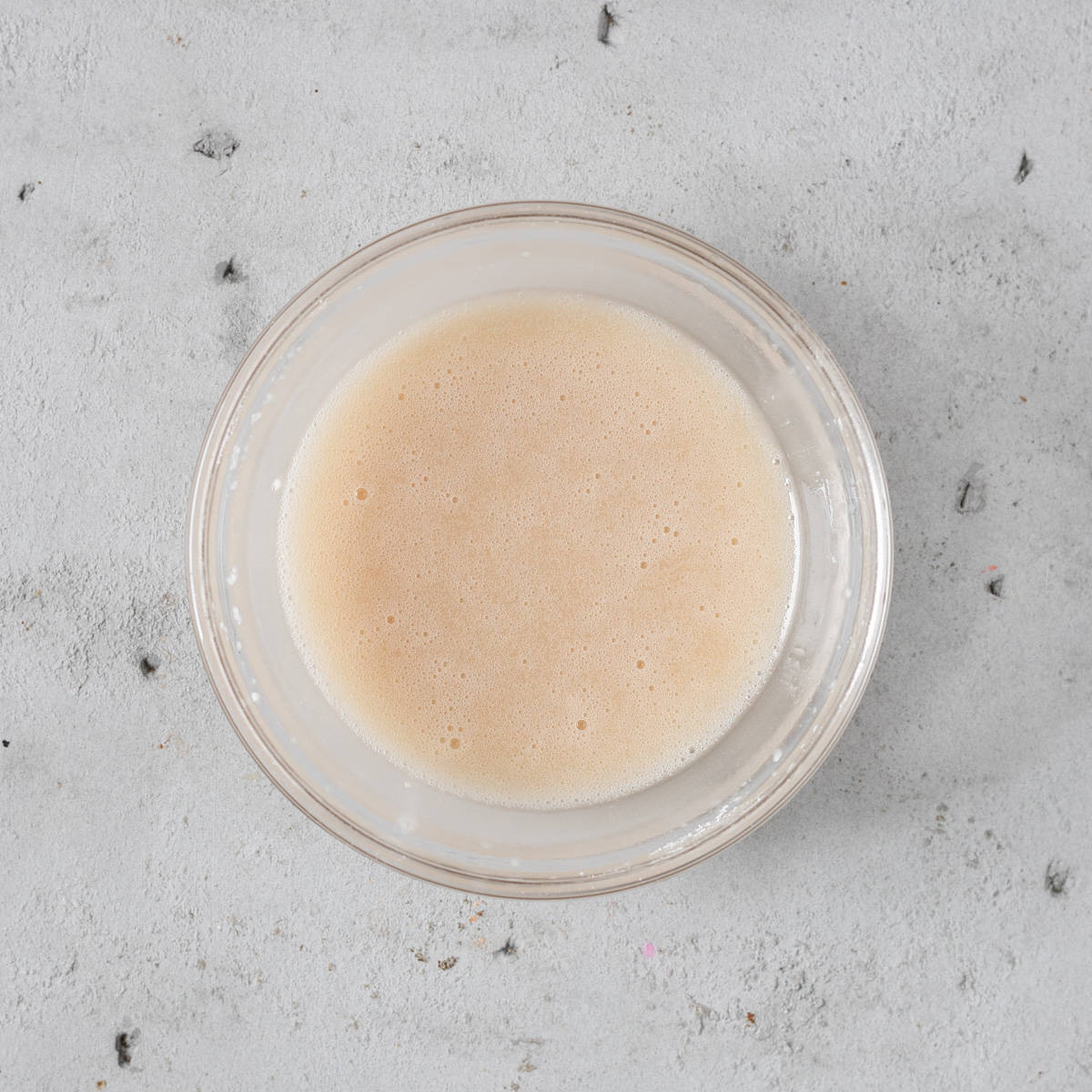 the dipping sauce in a glass bowl on a grey background.
