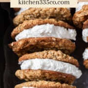a row of oatmeal cream pies in a metal baking pan. It says oatmeal cream pies across the top.
