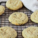 several lavender cookies on a metal cooling rack.