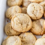 a white dish full of brown butter cookies.