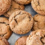 several ginger cookies on a metal baking dish.
