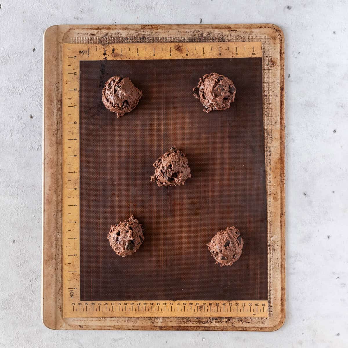 the brownie mix cookies on a baking sheet before being baked.