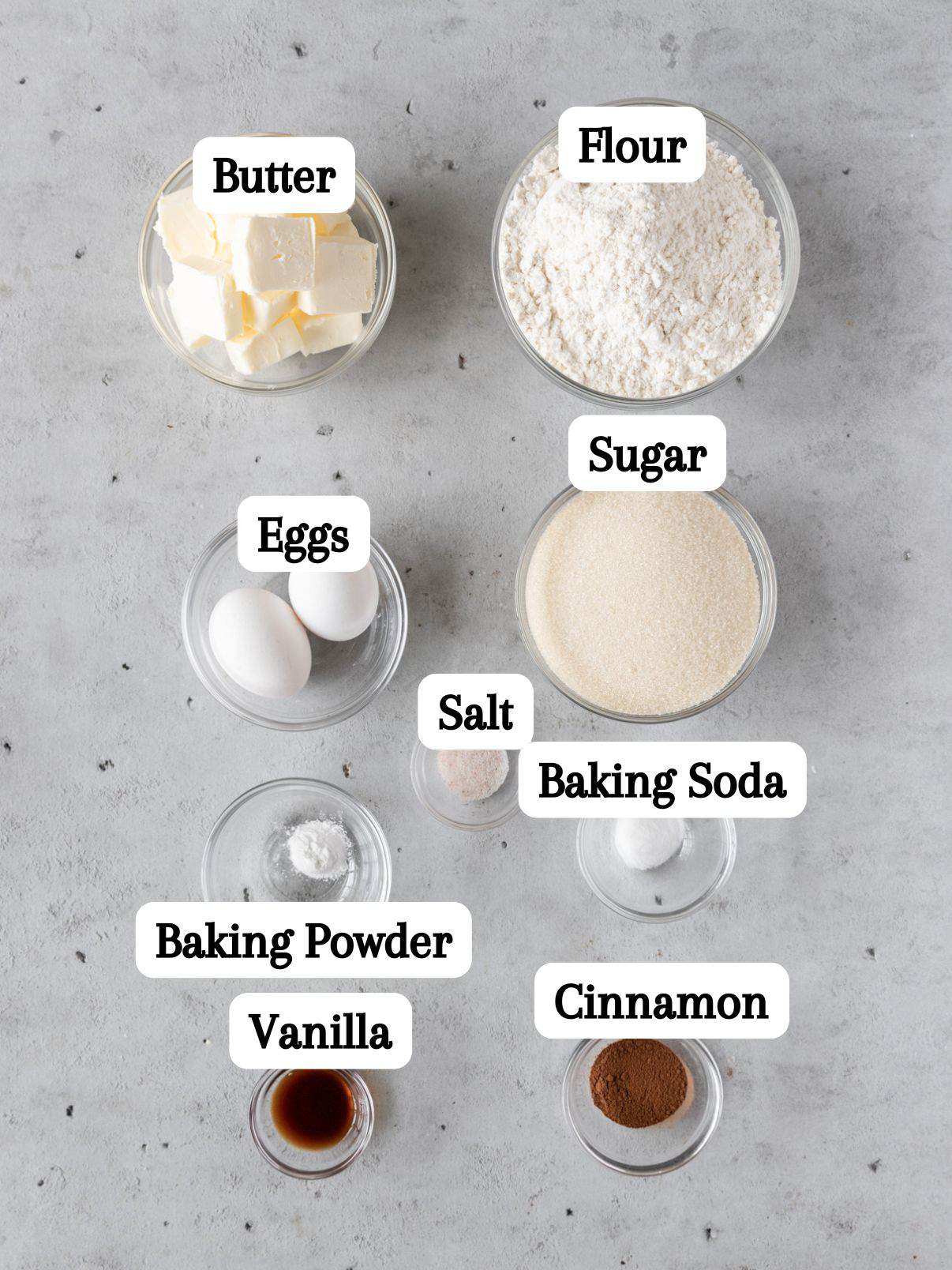 all of the ingredients laid out and labeled on a grey background.