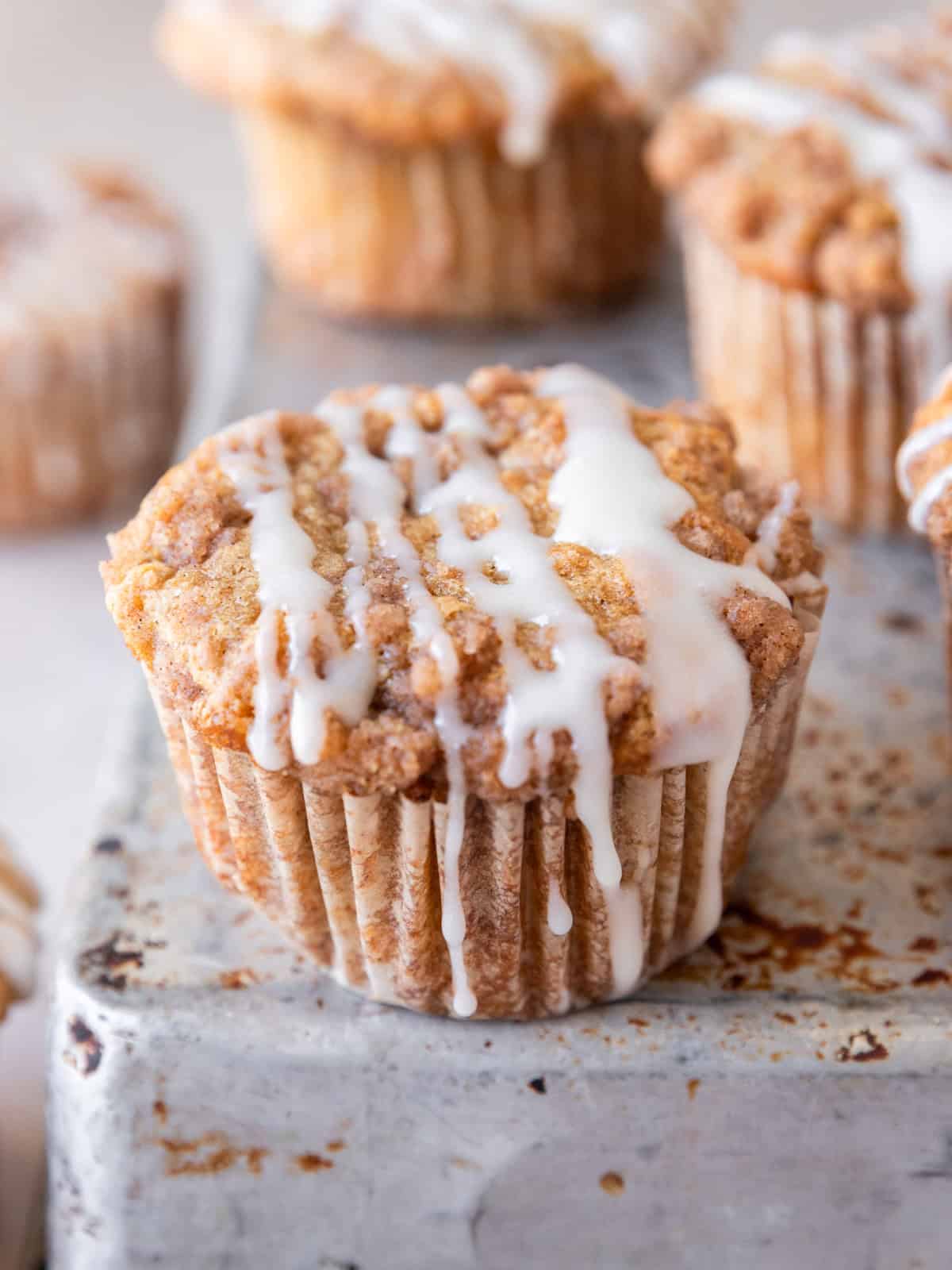 several coffee cake muffins on a metal dish.