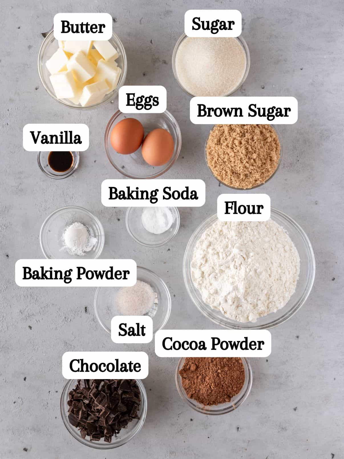 all of the ingredients laid out and labeled on a grey background.