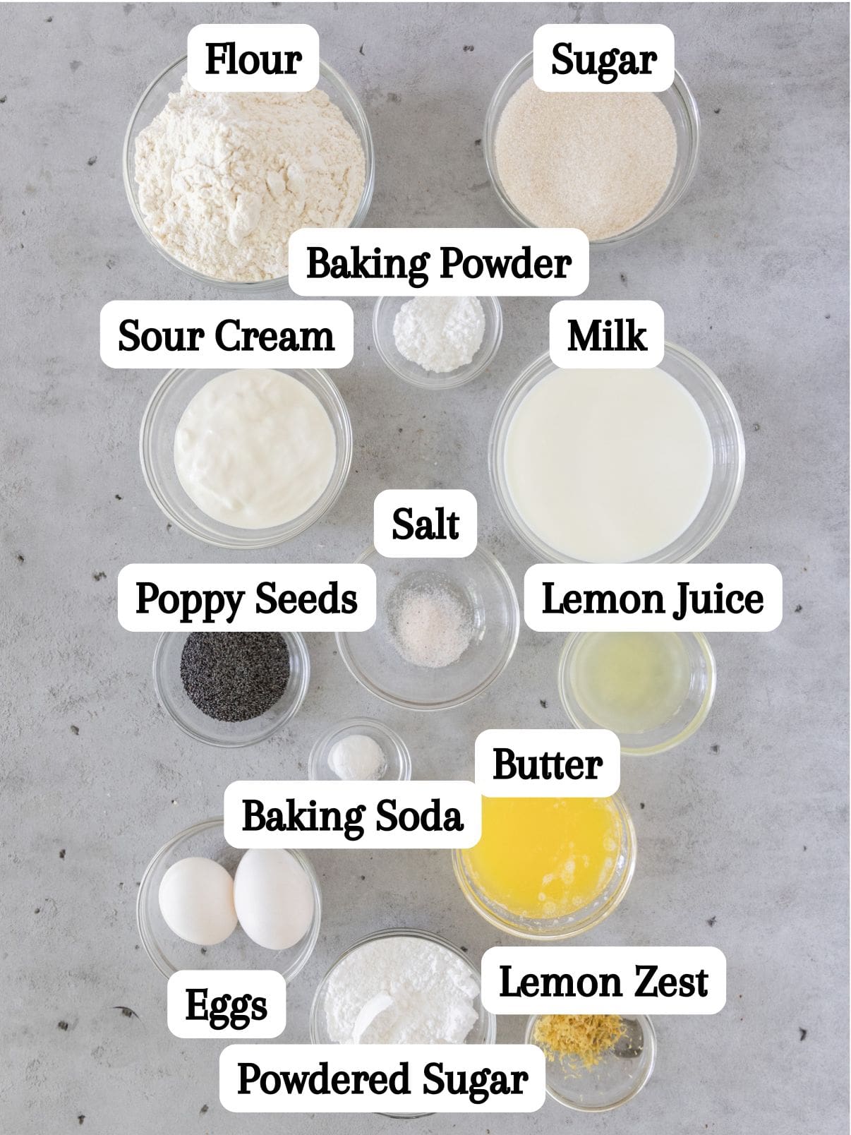 all of the ingredients laid out and labeled on a grey background.