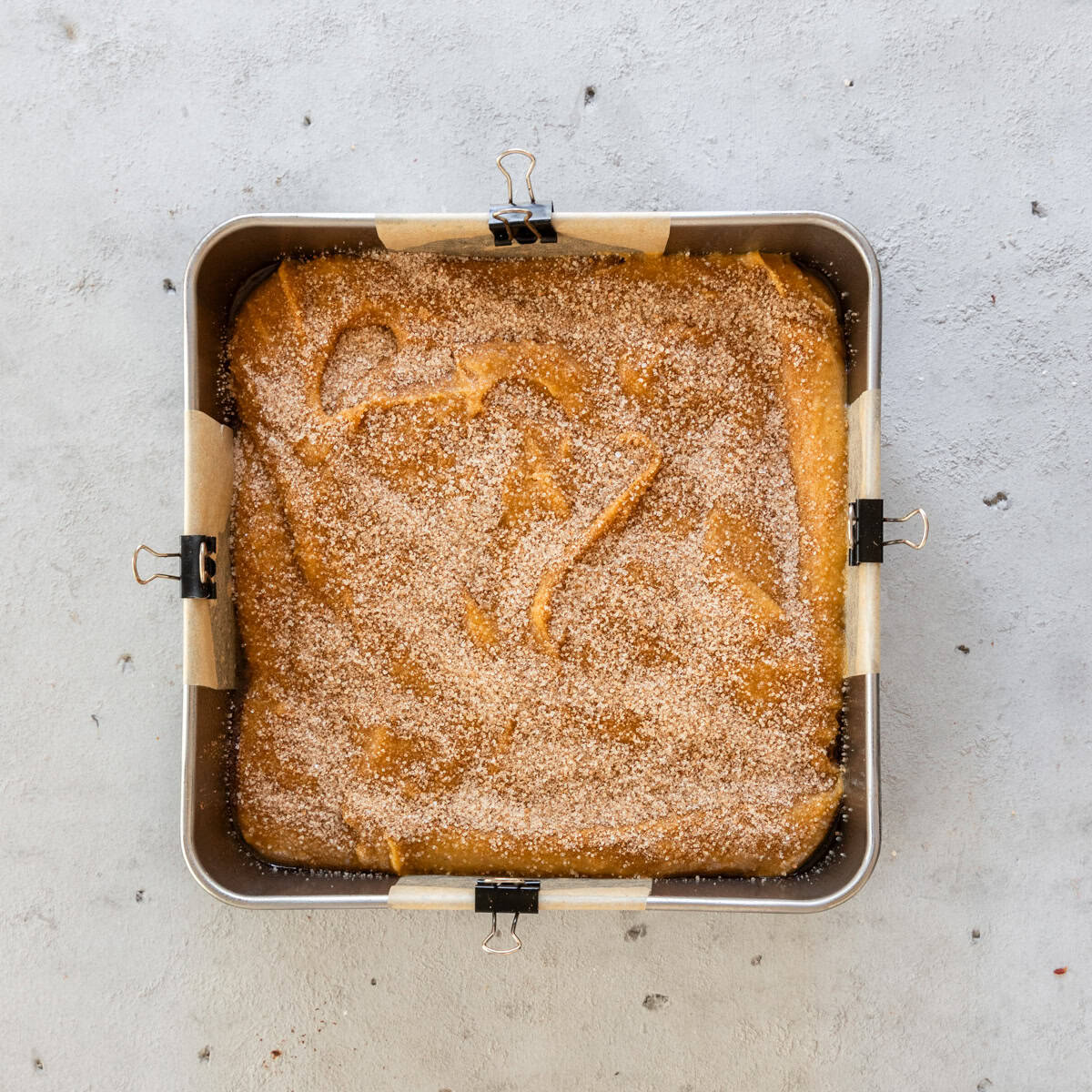 the easy pumpkin blondies in a metal baking tray before being baked.
