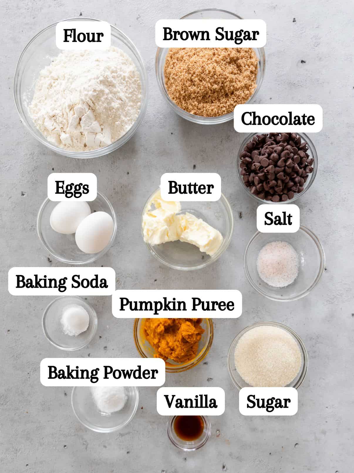all of the ingredients laid out and labeled on a grey background.