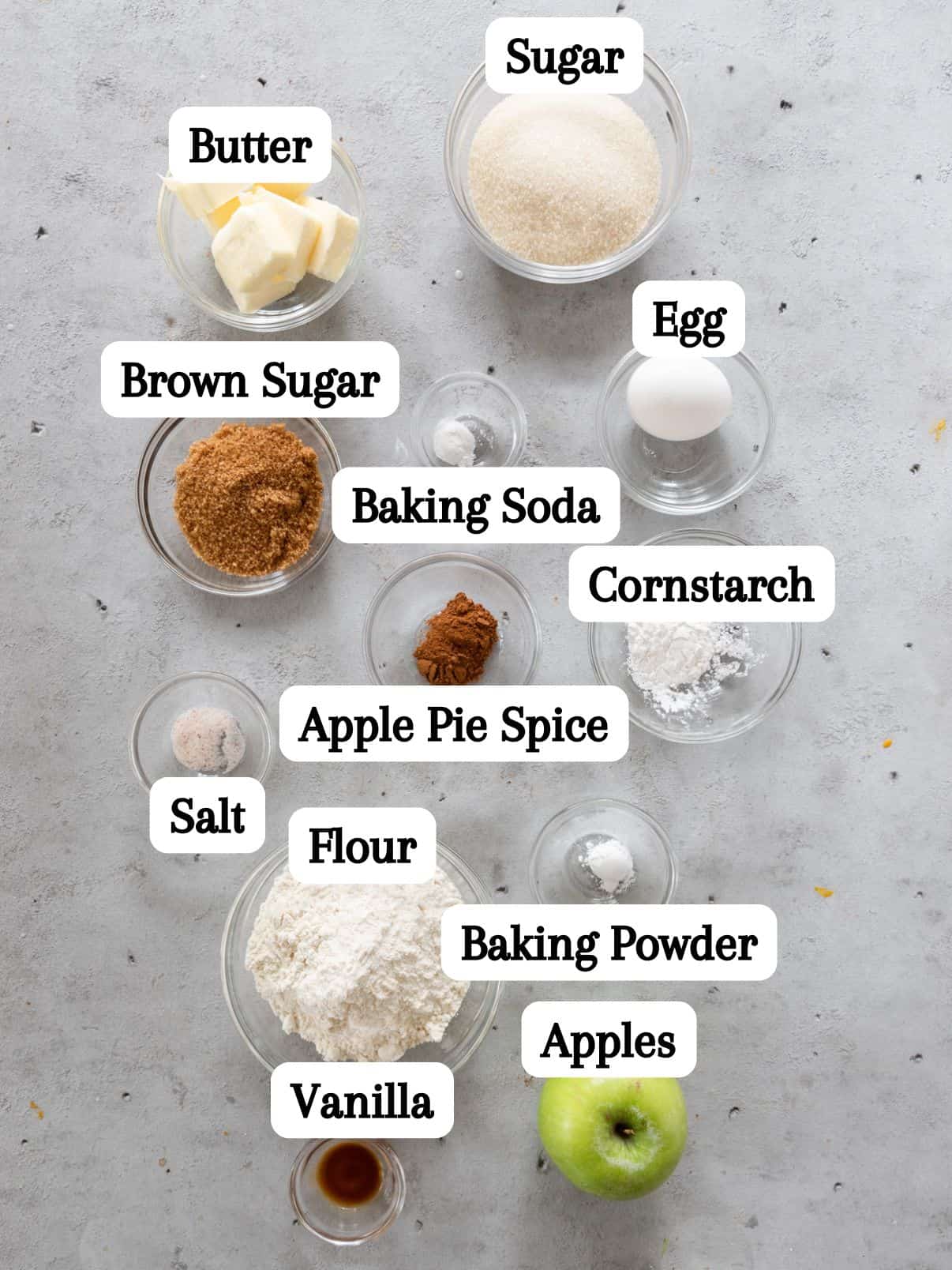 all of the ingredients laid out and labeled on a grey background.
