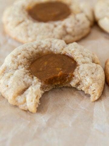a pumpkin pie cookie with a sugar cookie crust with a bite taken out of it.