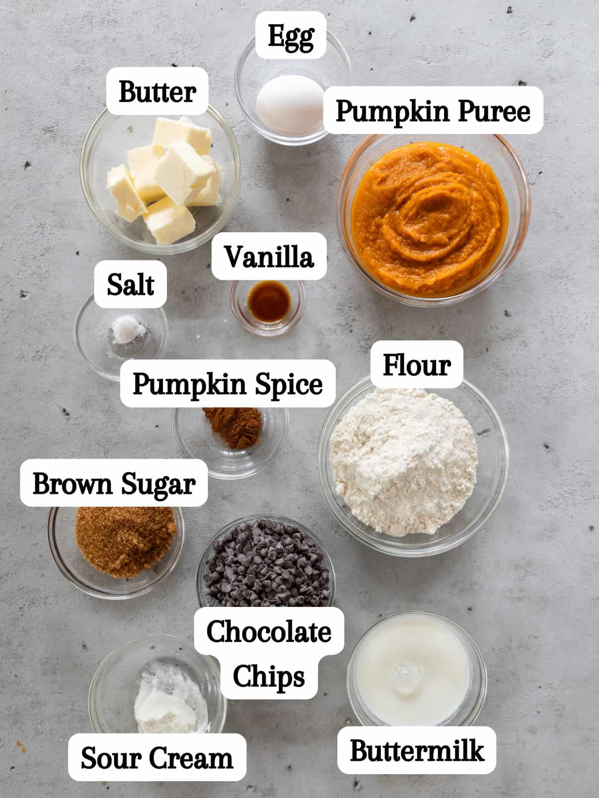 all of the ingredients laid out and labeled on a grey background.
