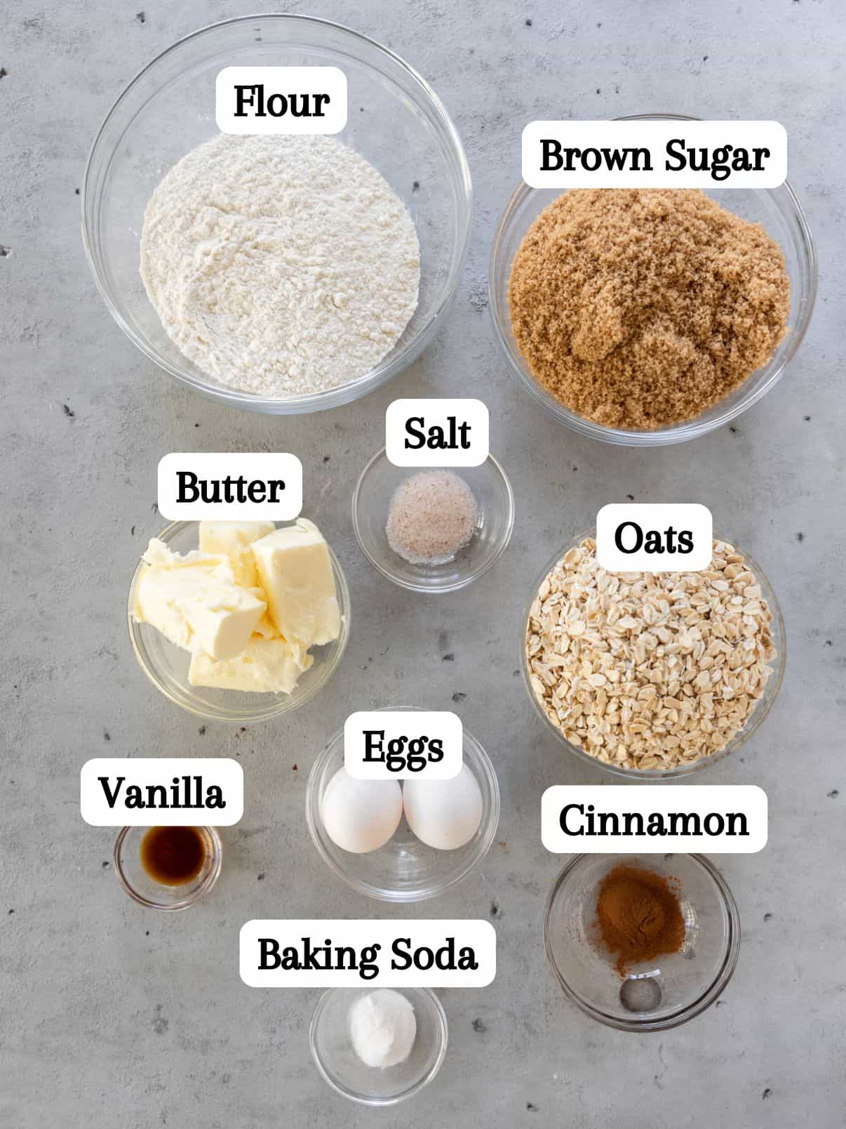 all of the ingredients laid out and labeled on a grey background.